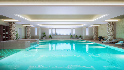 A serene indoor swimming pool, showcasing modern architecture and a tranquil atmosphere.