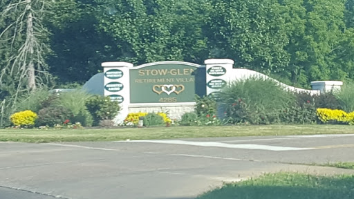 Welcome sign for Stow Glen, featuring a beautiful landscaped area.
