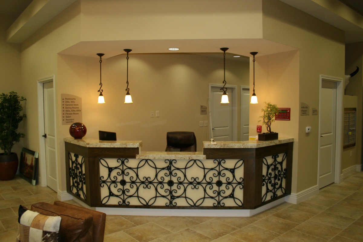 A modern reception area with decorative lighting and intricate design elements.