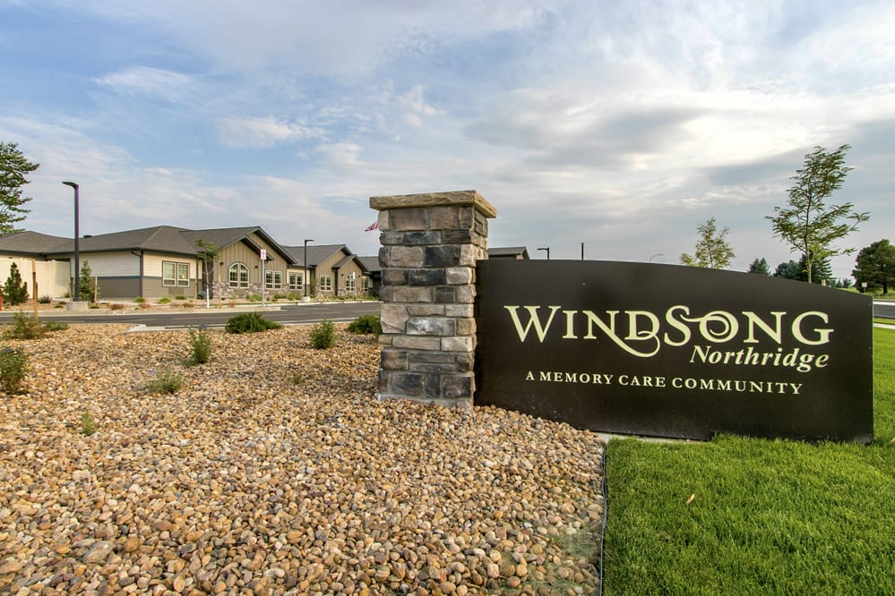 An exterior view of Windsor Nursing, featuring a sign and surrounding landscape.