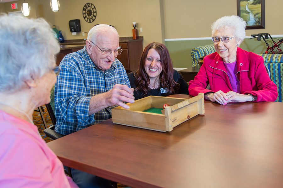A group of seniors enjoying a board game together.