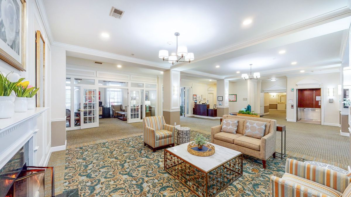 A modern lobby featuring comfortable seating, elegant lighting, and stylish decor.