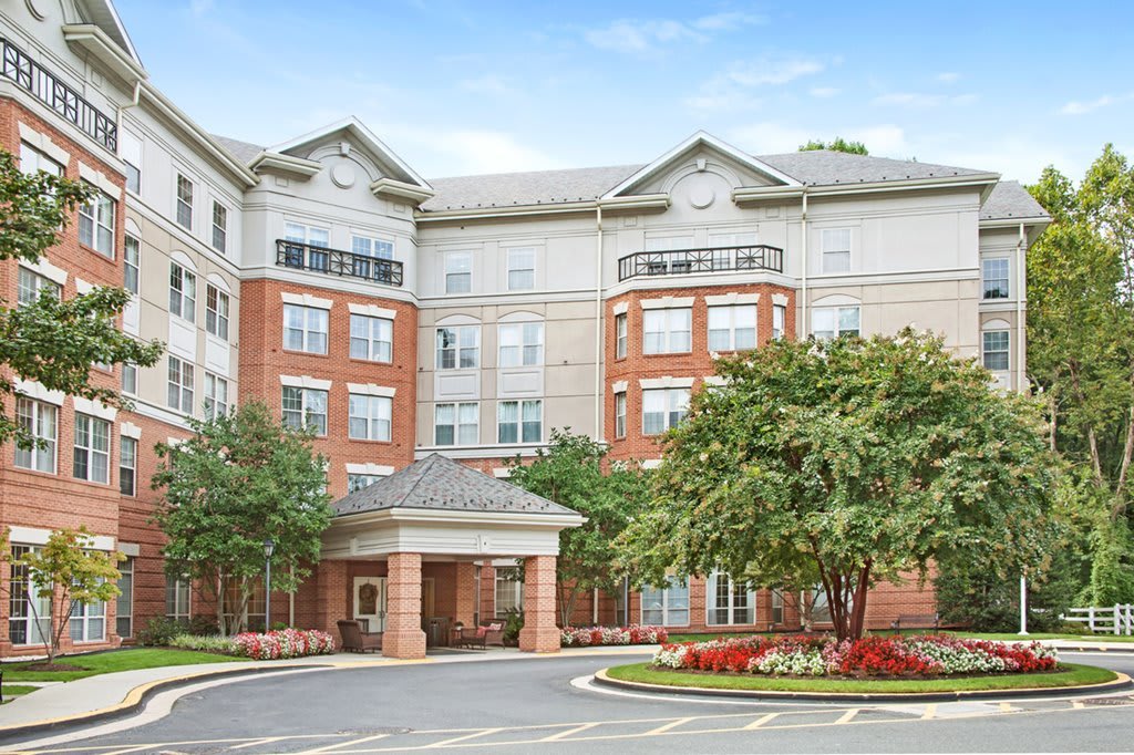 A residential apartment building with landscaped surroundings.