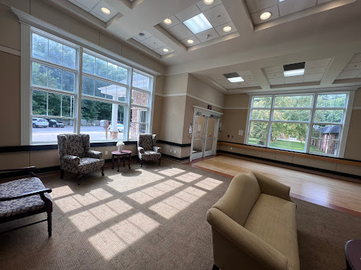 A bright and welcoming lobby featuring comfortable seating and ample natural light.
