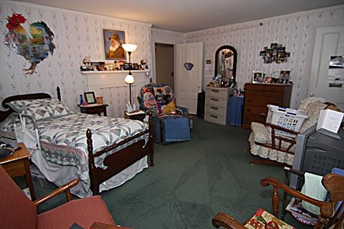 A vintage bedroom with classic furniture and decor elements.