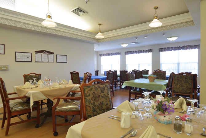 A cozy dining room with neatly arranged tables and elegant decor.