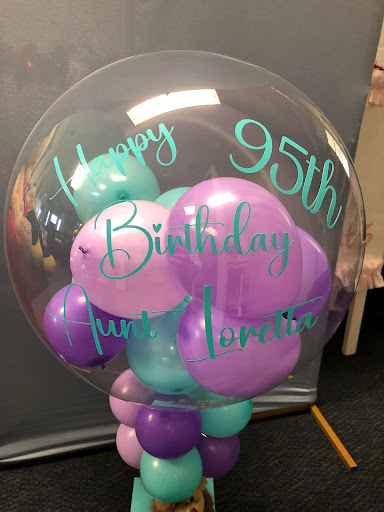 A festive balloon arrangement celebrating a special 95th birthday.