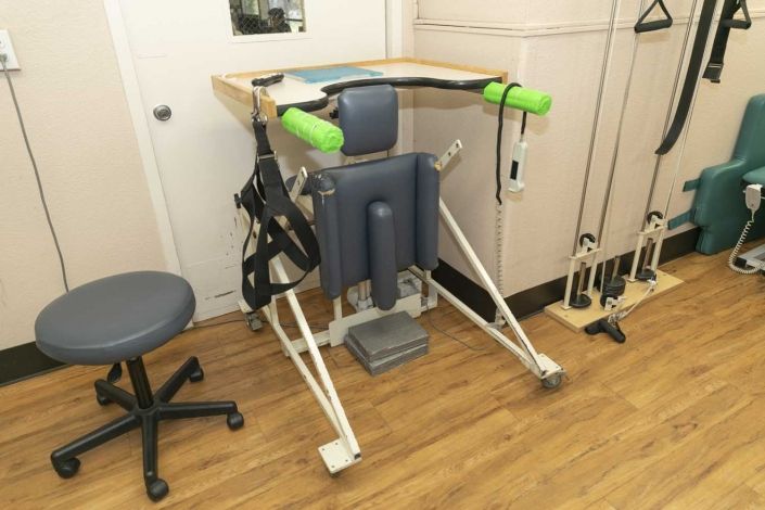A standing frame used for physical therapy and rehabilitation purposes.