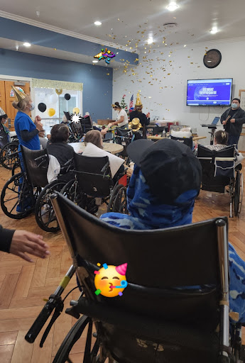 A lively social event for residents in wheelchairs, bringing joy and community spirit.