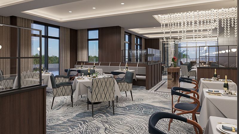 A modern restaurant interior with elegant furnishings and chandeliers.