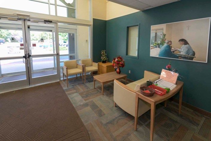 A cozy waiting area with comfortable seating and natural light.