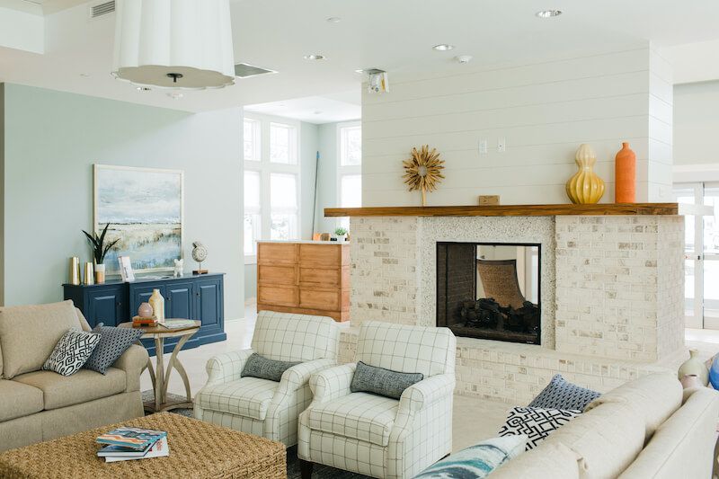 A cozy living room with modern decor and a fireplace.