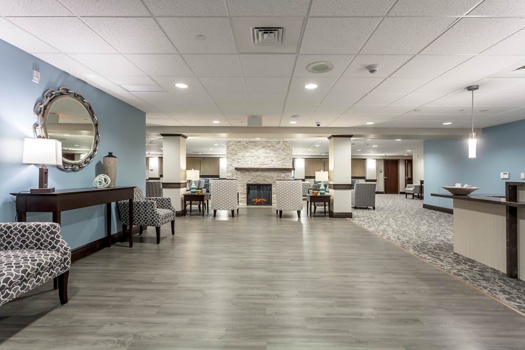 Modern hotel lobby with seating and stylish decor.