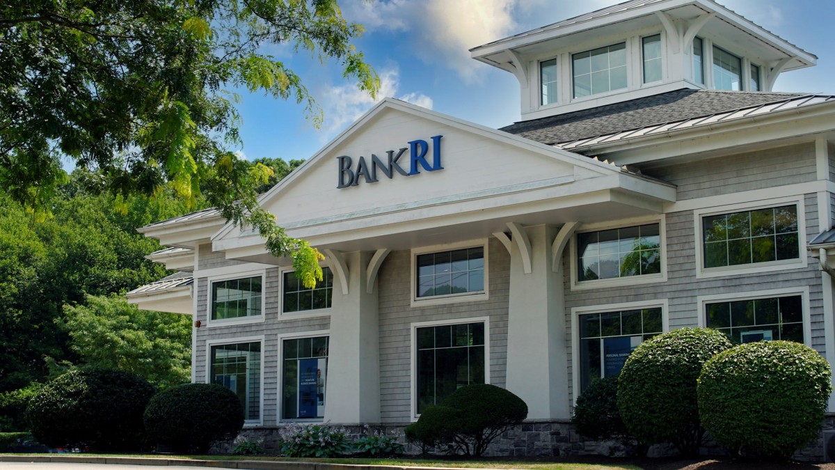 A commercial building with 'BANKRI' signage, featuring traditional architectural design.