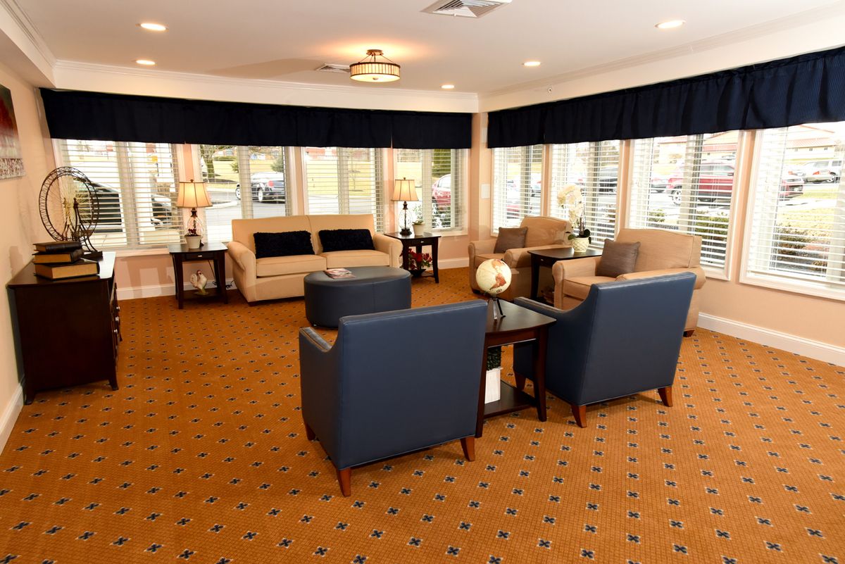A modern lobby with comfortable seating and bright lighting.