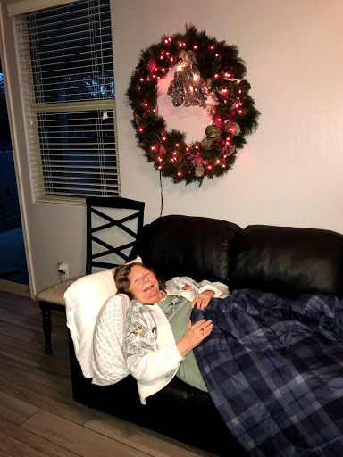 A cozy moment by the couch, enjoying the warmth of the holidays.
