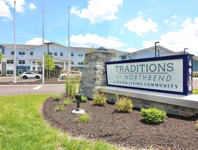 Entrance sign for Traditions at North Bend, a senior living community.