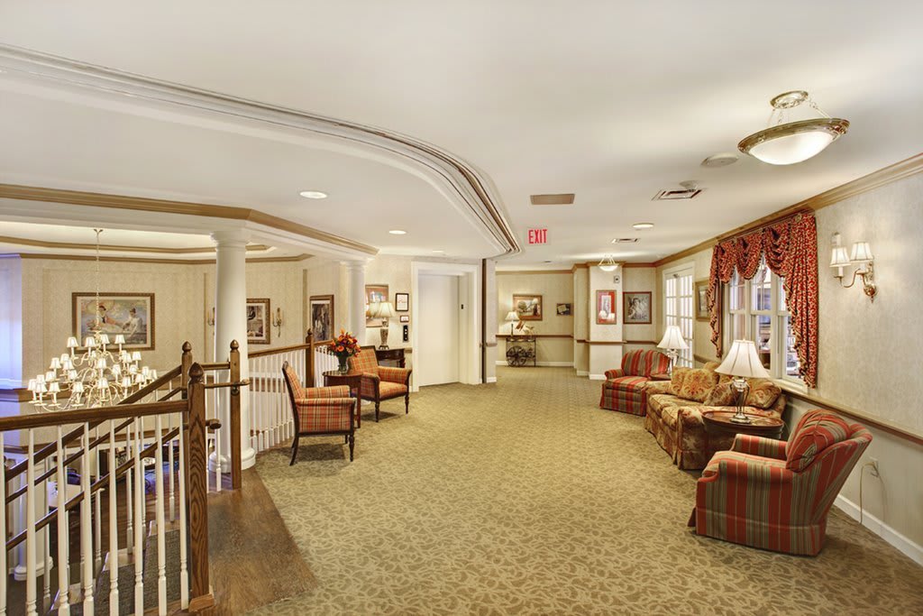 A cozy and inviting lobby area with comfortable seating and warm decor.
