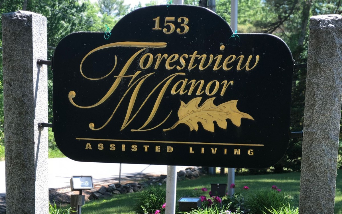 A sign for Forestview Manor Assisted Living located outdoors.