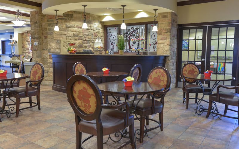 A cozy dining area with elegant furniture and warm lighting.