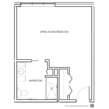 Floor plan of a studio apartment with a living room/bedroom and bathroom.