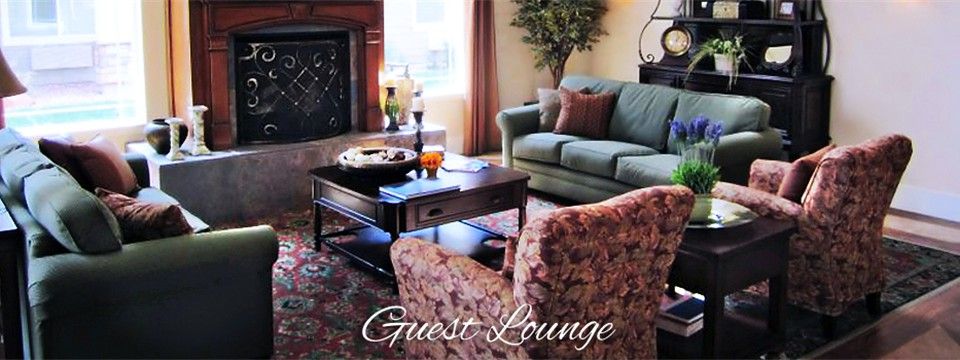 A cozy guest lounge with comfortable seating and elegant decor.