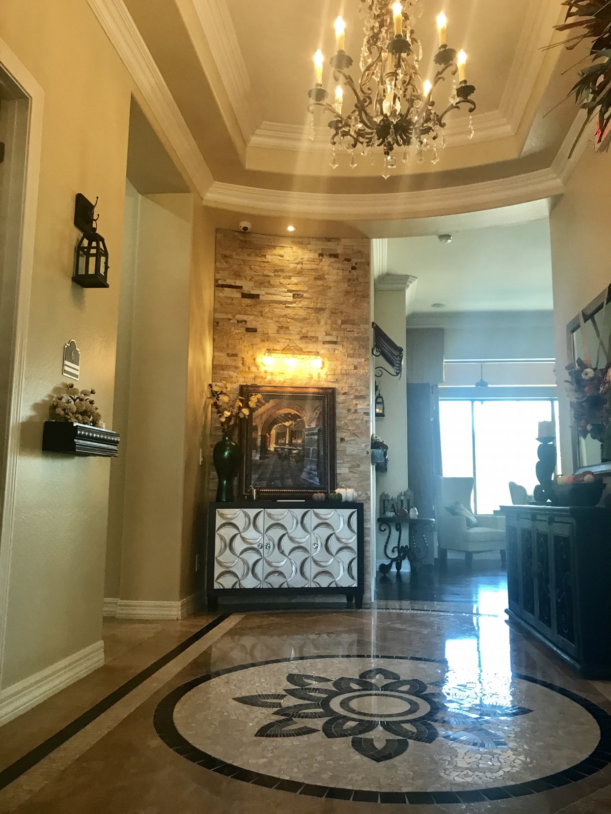 A luxurious foyer with elegant lighting and decor.