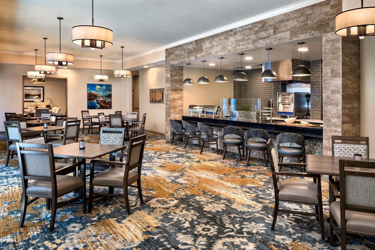 A modern restaurant dining area with stylish seating and lighting.