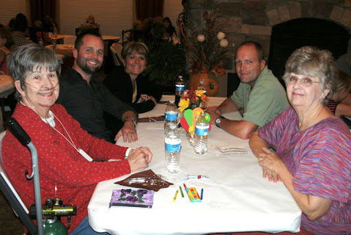 A group of friends enjoying a meal together at a restaurant.