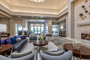 A modern lobby with comfortable seating and large windows.