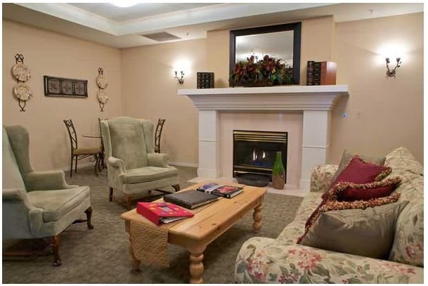 A cozy living room with comfortable seating and a fireplace.
