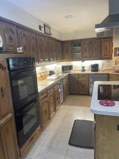 A cozy kitchen with wooden cabinets and modern appliances.