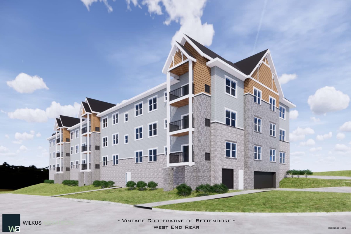 A modern apartment building with multiple floors and balconies, featuring a contemporary architectural design.