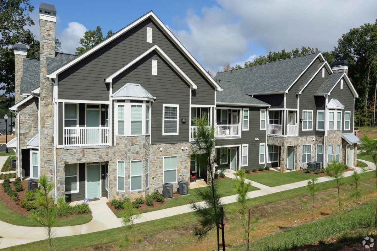 Modern apartment complex with a landscaped exterior.