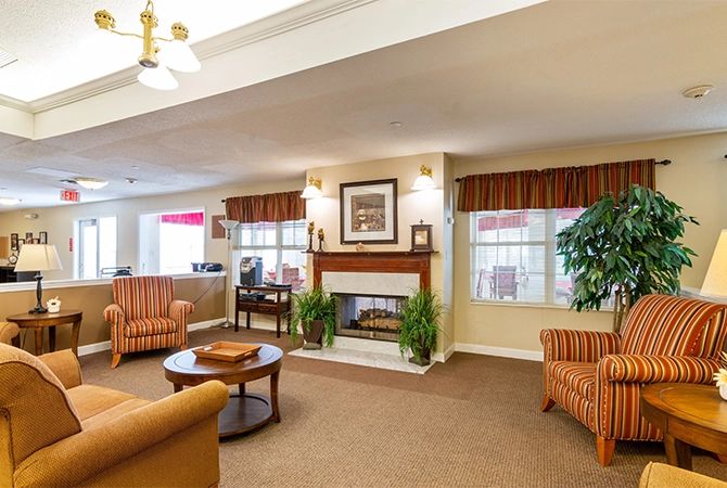 A cozy living room with comfortable seating and a fireplace.