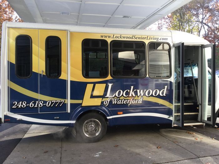 A bus featuring the Lockwood branding parked at a station.