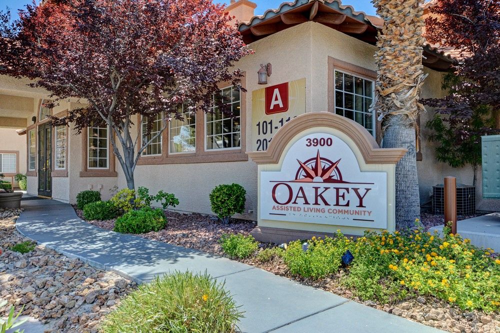 The entrance to Oakey Apartments, featuring a well-maintained landscape and clear signage.