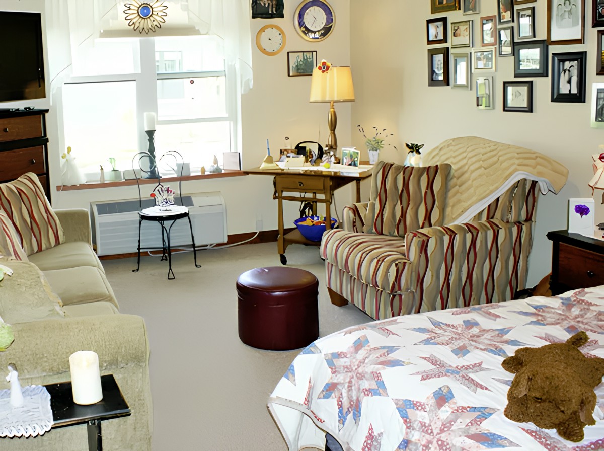 A cozy living room with comfortable seating and decorative wall art.