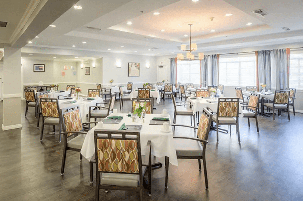 An elegant dining room with neatly arranged tables and chairs, showcasing tasteful interior design.