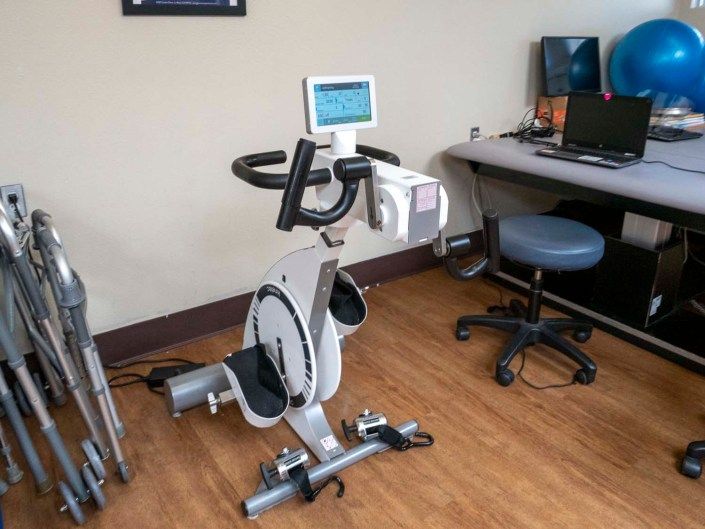 An exercise bike positioned in an office setting, ready for use.