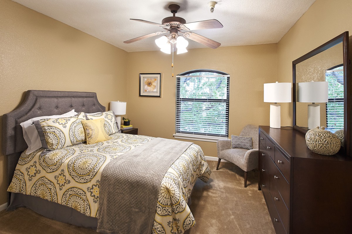 Cozy bedroom with elegant furnishings and warm lighting.