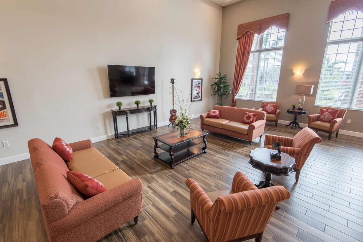 A spacious living room with comfortable seating and modern decor.