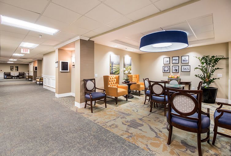 A well-lit lobby area featuring comfortable seating and elegant decor.