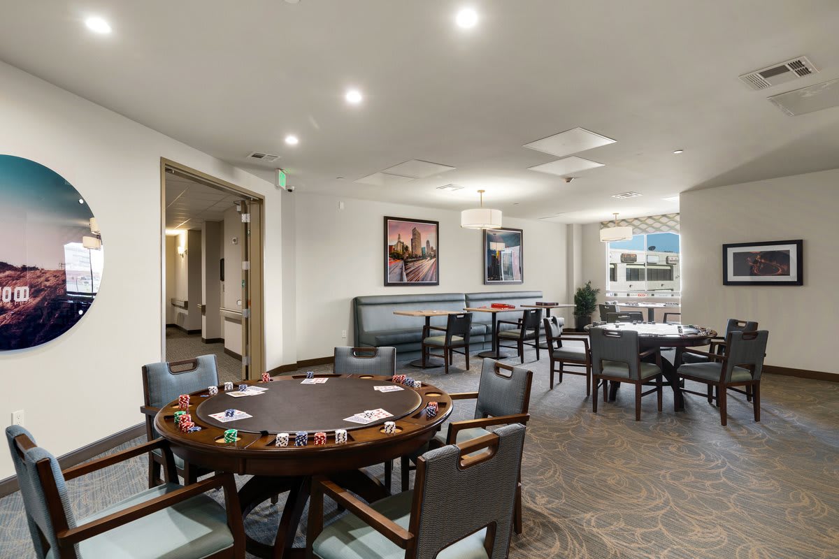 A cozy leisure room featuring a poker table and comfortable seating, perfect for card games.