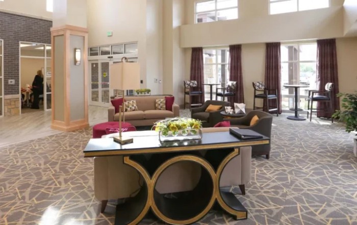A modern hotel lobby with elegant furniture and decor.