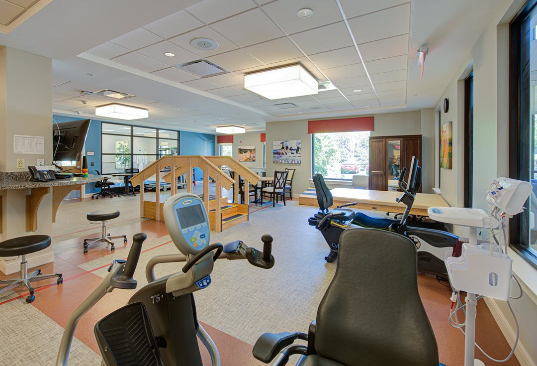 A well-equipped rehabilitation center with various exercise machines and therapy equipment.