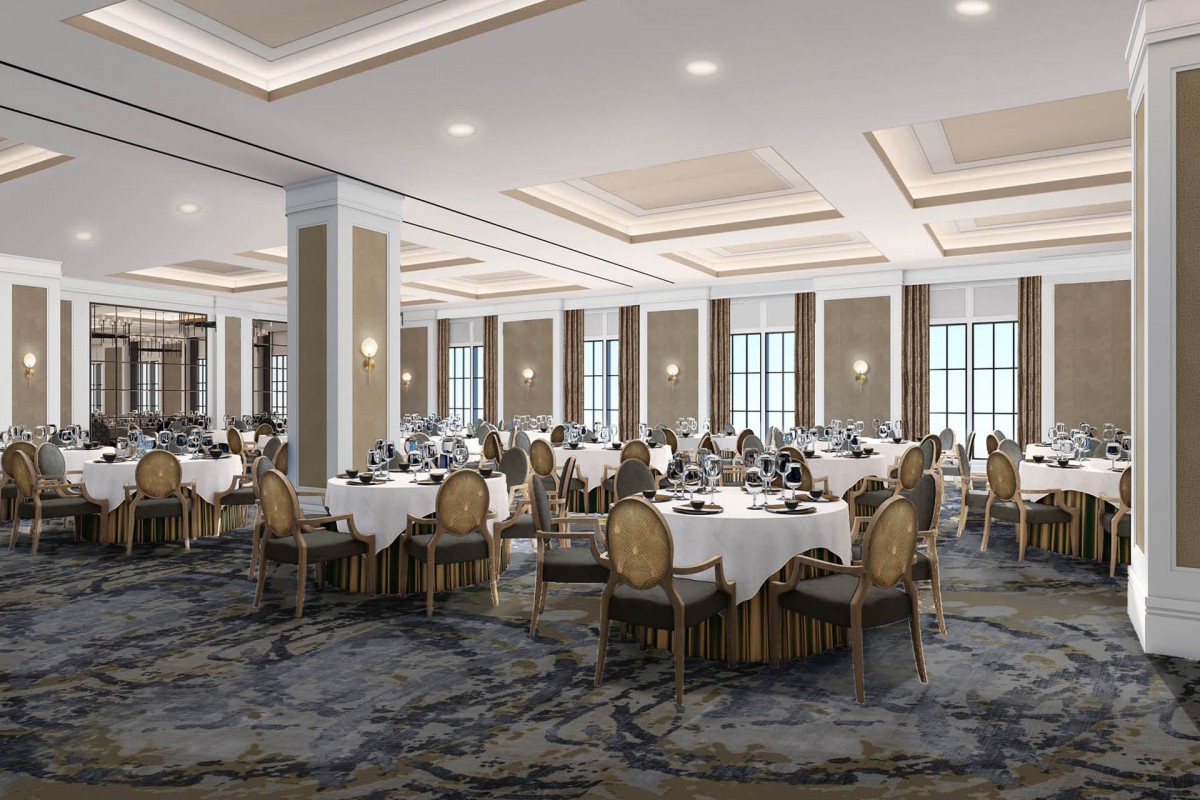 An elegant banquet hall set up with round dining tables and luxurious decor.