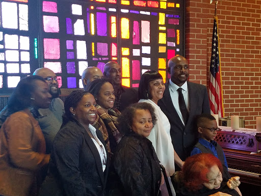 A joyful gathering of friends and family at a community event.
