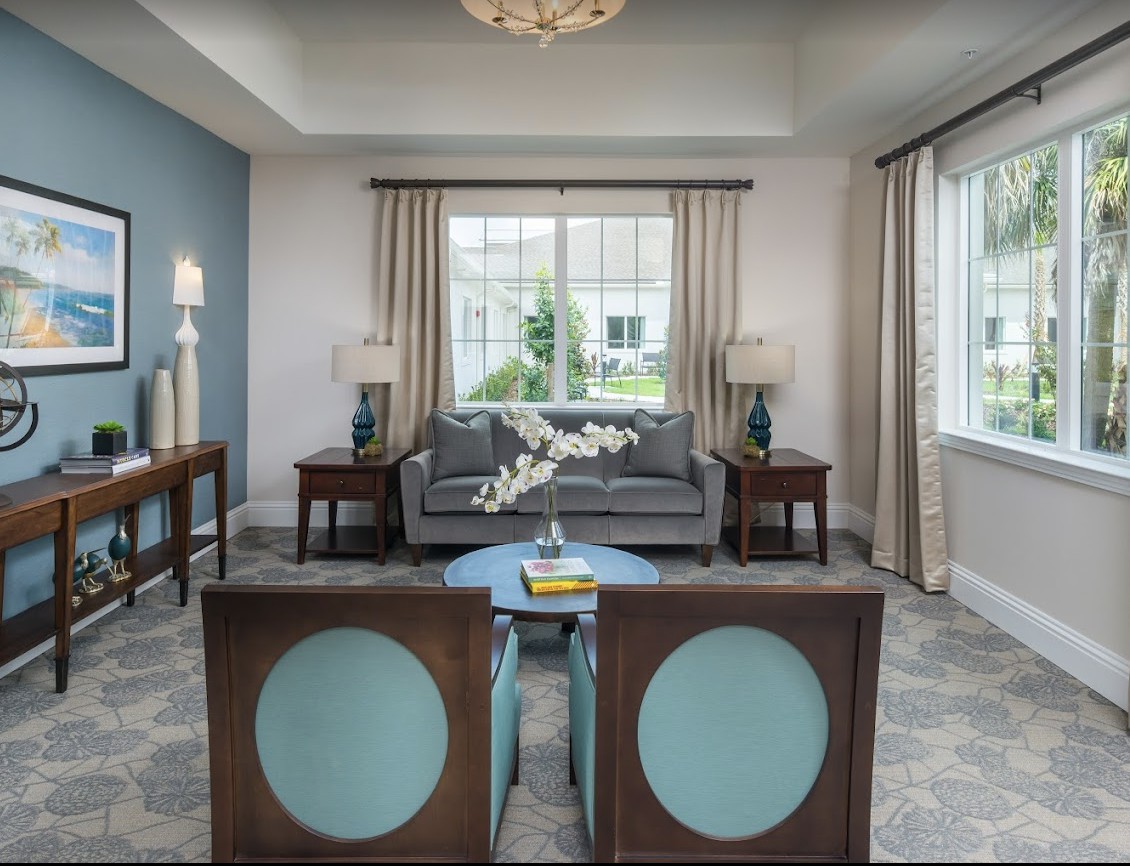 A well-decorated living room featuring elegant furniture and soft lighting.