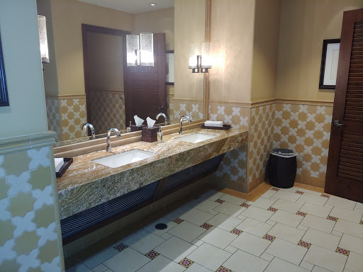 A well-designed bathroom interior featuring dual sinks and elegant lighting.